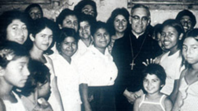 Archbishop Oscar Romero, surrounded by women from San Salvador